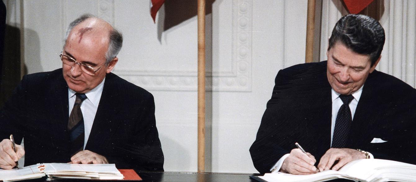Ronald Reagan and Mikhail Gorbachev sign the INF Treaty in the east room of the White House.